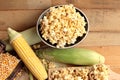 Popcorn and yellow dry corn grain with fresh corn. Royalty Free Stock Photo