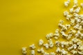 Popcorn on yellow paper background