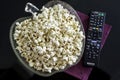 Popcorns in a bowl on a table Royalty Free Stock Photo