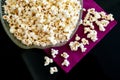 Popcorns in a bowl on a table Royalty Free Stock Photo