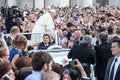 Pope Francis in the crowd in St. Peter `s in Vatican City in Rome, Italy. The Pope greets the faithful and meets them Royalty Free Stock Photo