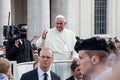 Pope Francis in the crowd in St. Peter`s in Vatican City in Rome, Italy. The Pope greets the faithful and meets them. Royalty Free Stock Photo