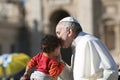 Pope Francis kiss child