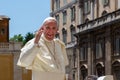 Pope Francis on the popemobile greets and blesses the faithful