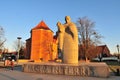 Pope John XXIII Granite Statue with Roman Catholic church of St. Marcin in the back. Wroclaw Royalty Free Stock Photo