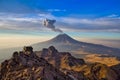 Popocatepetl volcano in Mexico, Tourist on the peak of high rocks. Sport and active life concept Royalty Free Stock Photo