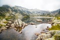 Popovo lake at Bezbog region, Bulgaria and mountains in the fog Royalty Free Stock Photo