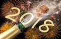 Popping champagne and fireworks at new years eve 2018 Royalty Free Stock Photo