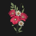 Poppy and camomile flowers embroidered with red and green stitches on black background. Embroidery design with beautiful