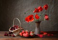 Poppy in a ceramic vase, cherries and strawberries Royalty Free Stock Photo