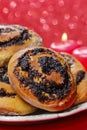 Poppy seed buns on cake stand. Christmas eve setting Royalty Free Stock Photo