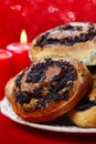 Poppy seed buns on cake stand. Christmas eve setting Royalty Free Stock Photo