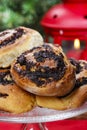 Poppy seed buns on cake stand. Christmas eve setting Royalty Free Stock Photo