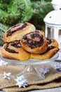 Poppy seed buns on cake stand. Christmas eve setting Royalty Free Stock Photo
