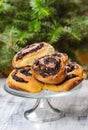 Poppy seed buns on cake stand. Christmas eve setting Royalty Free Stock Photo