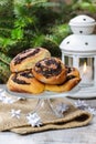 Poppy seed buns on cake stand. Christmas eve setting Royalty Free Stock Photo