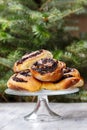 Poppy seed buns on cake stand. Christmas eve setting Royalty Free Stock Photo