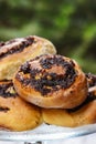 Poppy seed buns on cake stand. Christmas eve setting Royalty Free Stock Photo