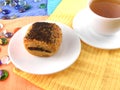 Poppy seed cake on plate and cup of tea (coffee)