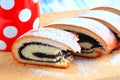Poppy seed strudel and red cup with white polka dots