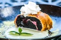 Poppy seed strudel sprinkled with powdered sugar and mint leaf Royalty Free Stock Photo