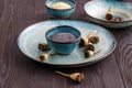 Poppy seeds and seedpods in ceramic bowl