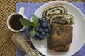 Poppy seeds strudel with cup of coffee and blueberry Royalty Free Stock Photo