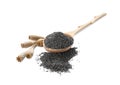 Poppy seeds and wooden spoon on background