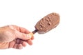 Popsicle, ice cream covered with chocolate in hand isolated on white background Royalty Free Stock Photo