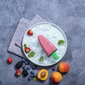 Popsicle ice cream with fruits and berries, summer dessert, natural vegan, vegetarian homemade sweets, square image