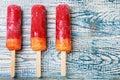 Popsicles on a wooden table Royalty Free Stock Photo