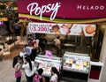 Popsy ice cream shop. People buying delicious ice cream cones and milkshakes