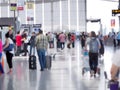 Popular airport flights are popular. And there are many people to use the service. This image is blurry