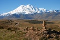 A popular automobile route in the mountains with a landmark made of pyramids made of stones.