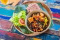 Popular Balinese meal of rice with variety of side dishes which are served together with the rice and more as optional extras