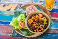 Popular Balinese meal of rice with variety of side dishes which are served together with the rice and more as optional