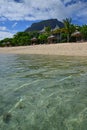 Popular Beach Resort at Le Morne, Mauritius with very clear water and Le Morne Brabant Mountain in the background