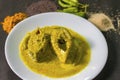 Popular Bengali Illish/Hilsa fish curry with grinned mustard seed.