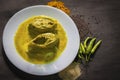 Popular Bengali Illish/Hilsa fish curry with grinned mustard seed.