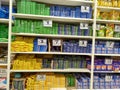 Popular brands displayed on aisle in a modern grocery outlet at a supermarket. with shopping cart.