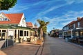 Popular city center with small tourist shops and restaurants in De Koog on the island Texel in the Netherlands on morning of sunny