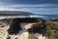 Popular coast with white beaches near the village of Orzola