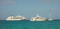 A cruise ship and a luxury yacht anchored in the shelter of admiralty bay, bequia Royalty Free Stock Photo