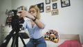 Popular female blogger is turning on the camera and strating recording video