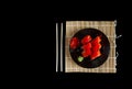 sushi, pickled ginger on a black plate. Served dish in Japanese style. Sushi chopsticks plate with rolls and bamboo Royalty Free Stock Photo