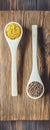 Popular healthy Asian and European cereals red lentil lens culinaris and bulgur in wooden culinary spoons