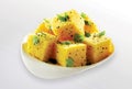 popular Indian Gujarati dish Traditional Street Food Sev Khaman Dhokla Served With Chutney or Chilly. selective focus - Image