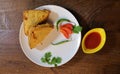 Popular Indian snacks BREAD PAKORA with tomato sauce and green chilli