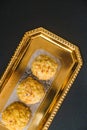 Popular Indian sweet dish known as Boondi laddu served in golden platter. Royalty Free Stock Photo