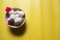 Popular Indian sweet rasgulla pieces in a bowl. Top view, copy space.